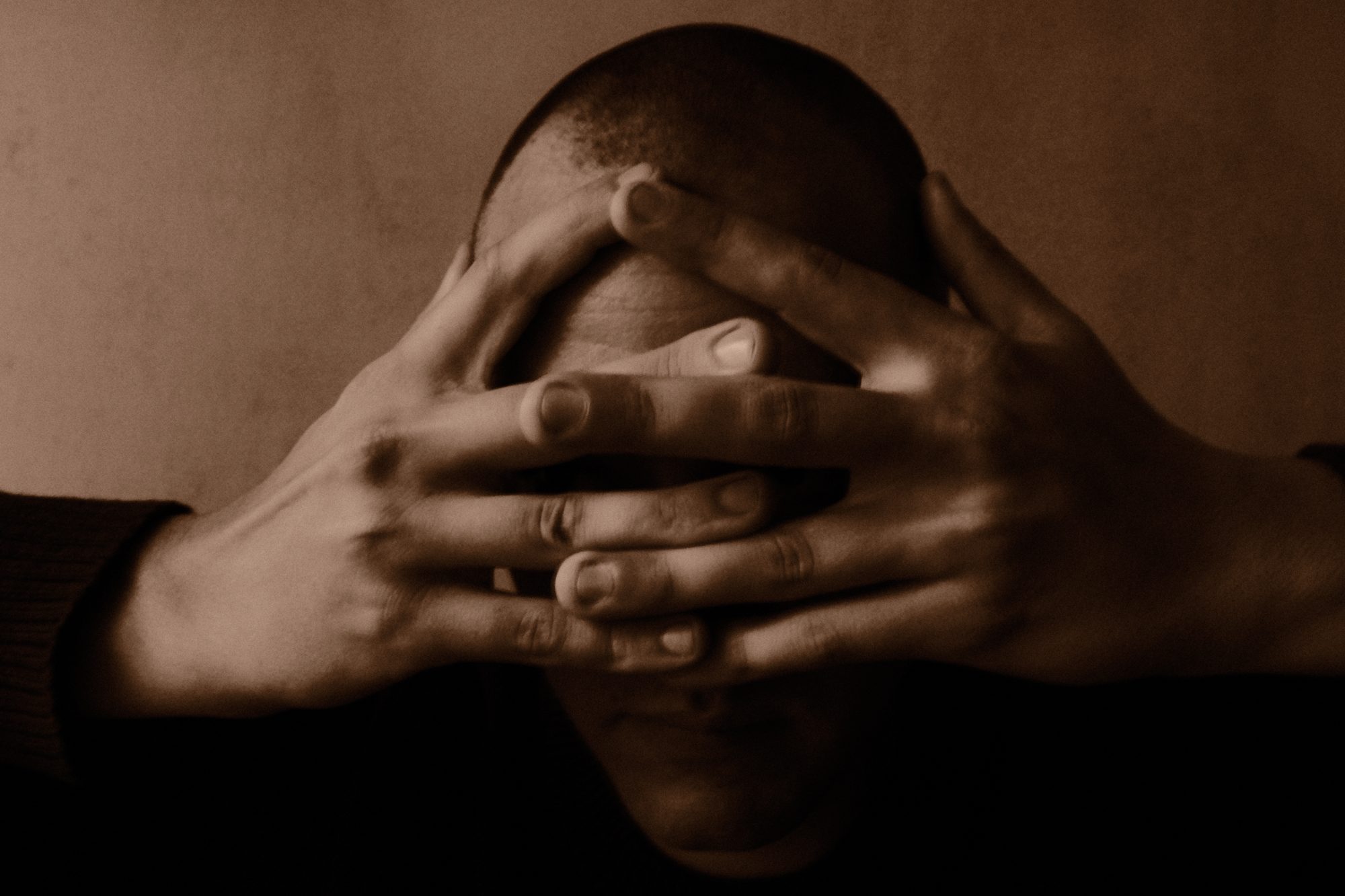 Connor Schultze, hands over face